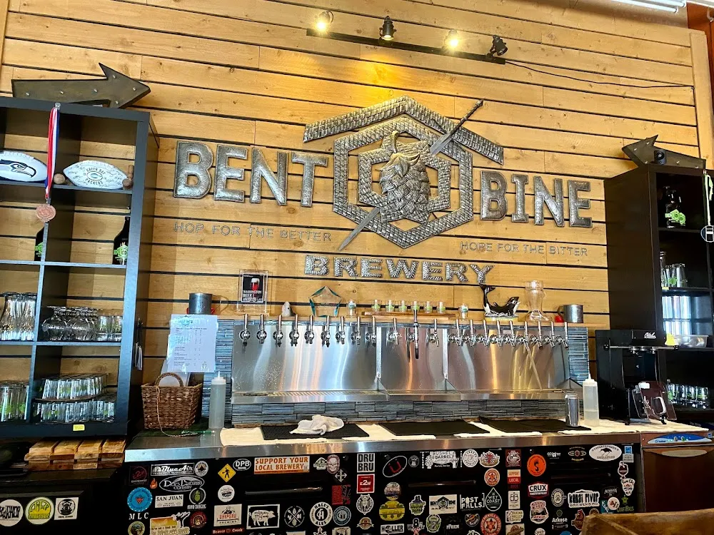 Tap wall and hop logo at Bent Bine Brewery, a family- and dog-friendly brewery in Belfair, WA