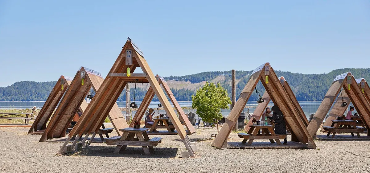 A-frame picnic shelters on the waterfront at Hama Hama Oyster Saloon on Hood Canal